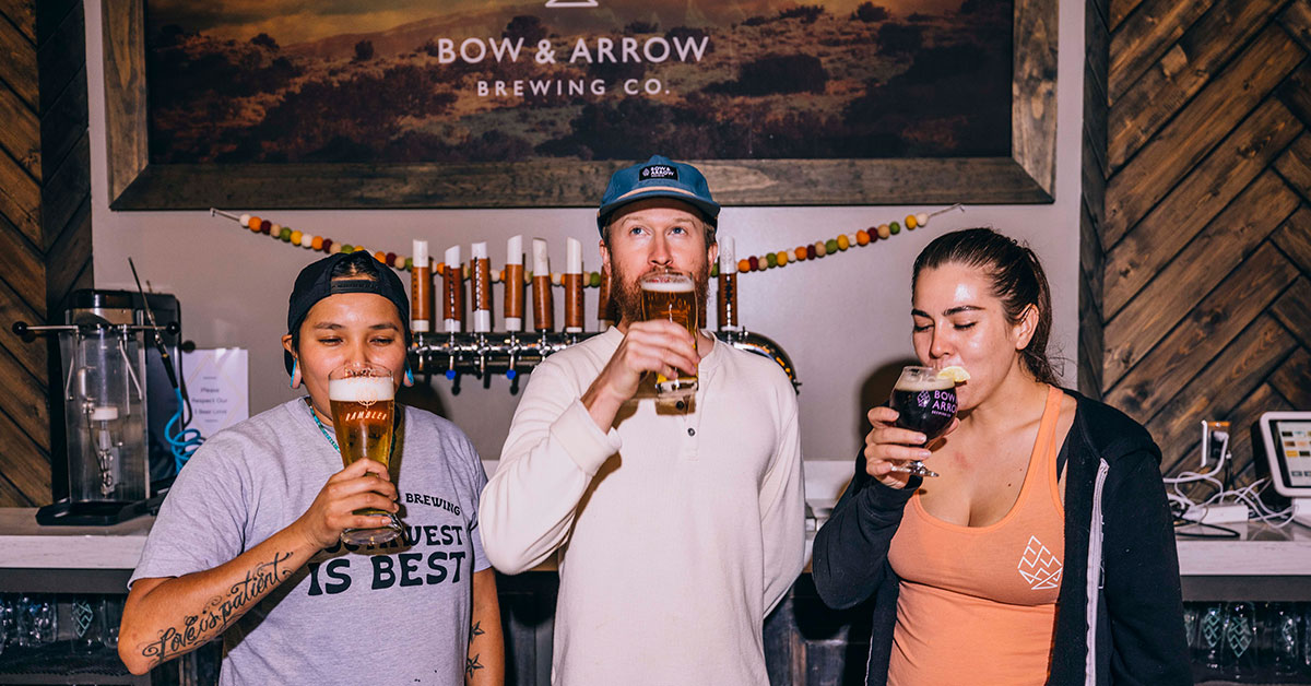 brewery-employees-tasting-beer-bow-and-arrow-brewing-co