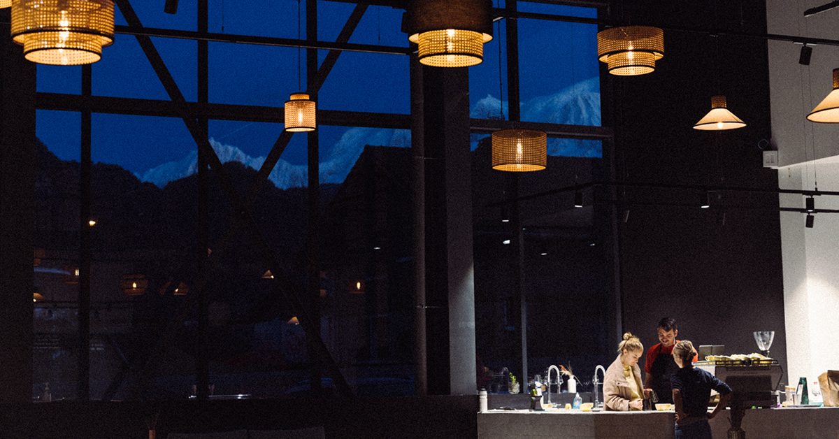 brewery interior with swiss alps in background