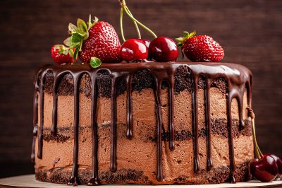 chocolate layer cake covered in fruit