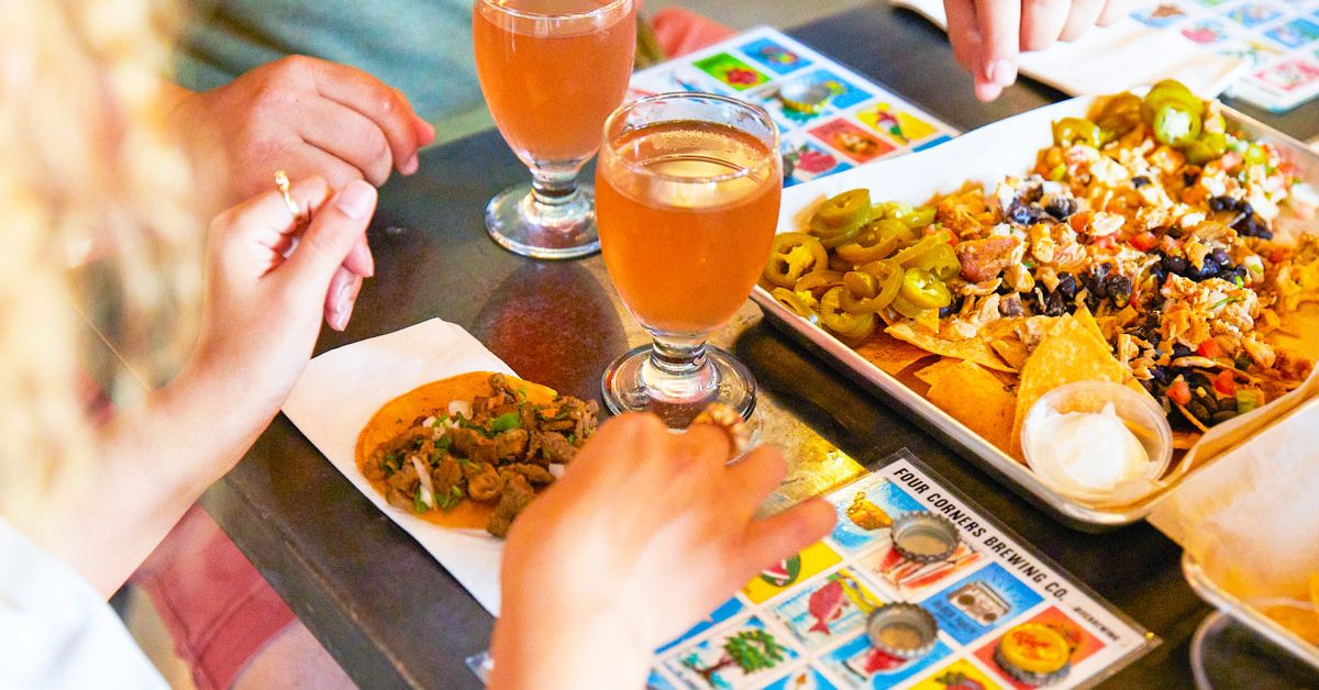 people playing bingo and drinking beer and eating nachos