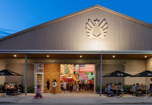 service brewery exterior with tables and patrons