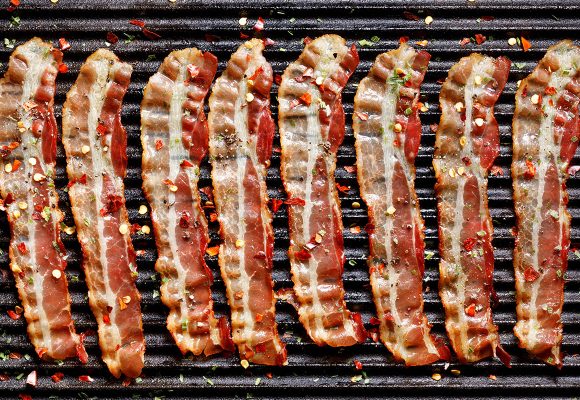 strips of bacon on grill