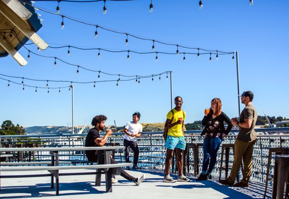 young beer enthusiasts enjoying island brewery patio