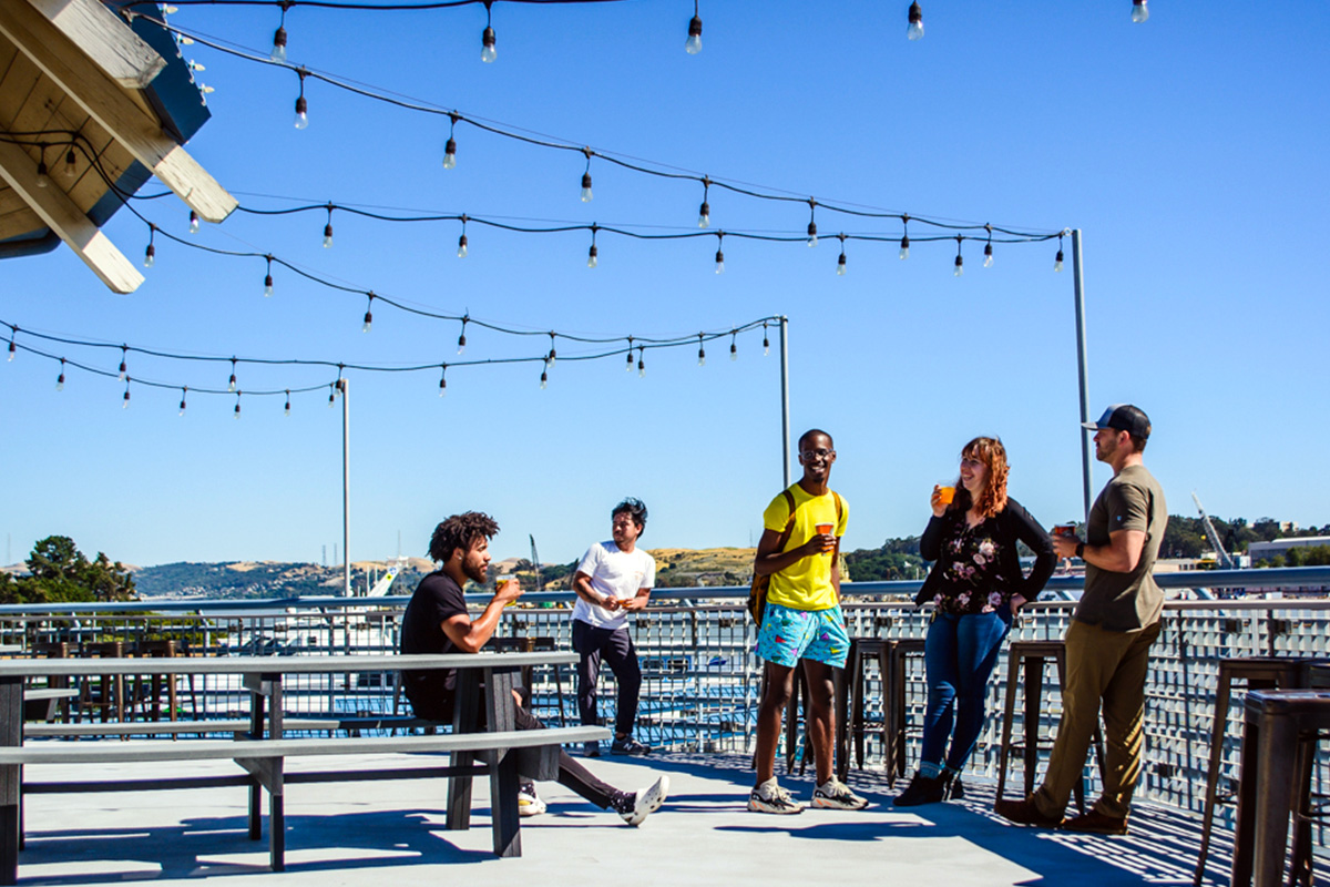 young beer enthusiasts enjoying island brewery patio